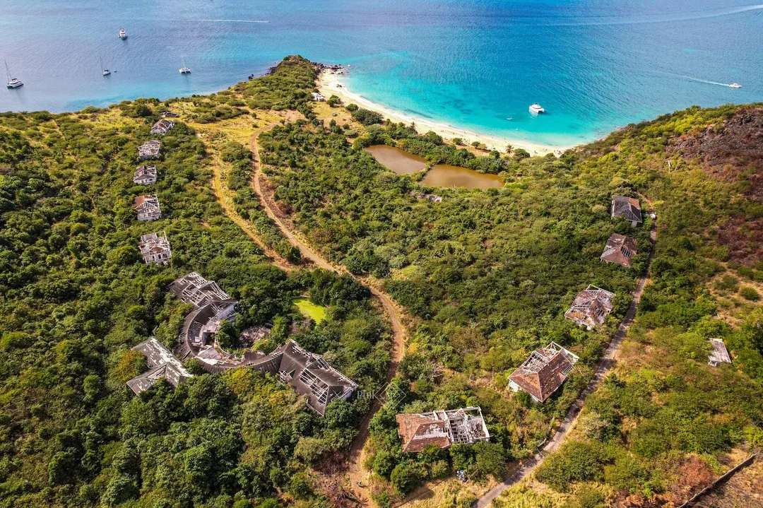Aerial view of Happy Bay, Saint-Martin, with catamarans anchored offshore