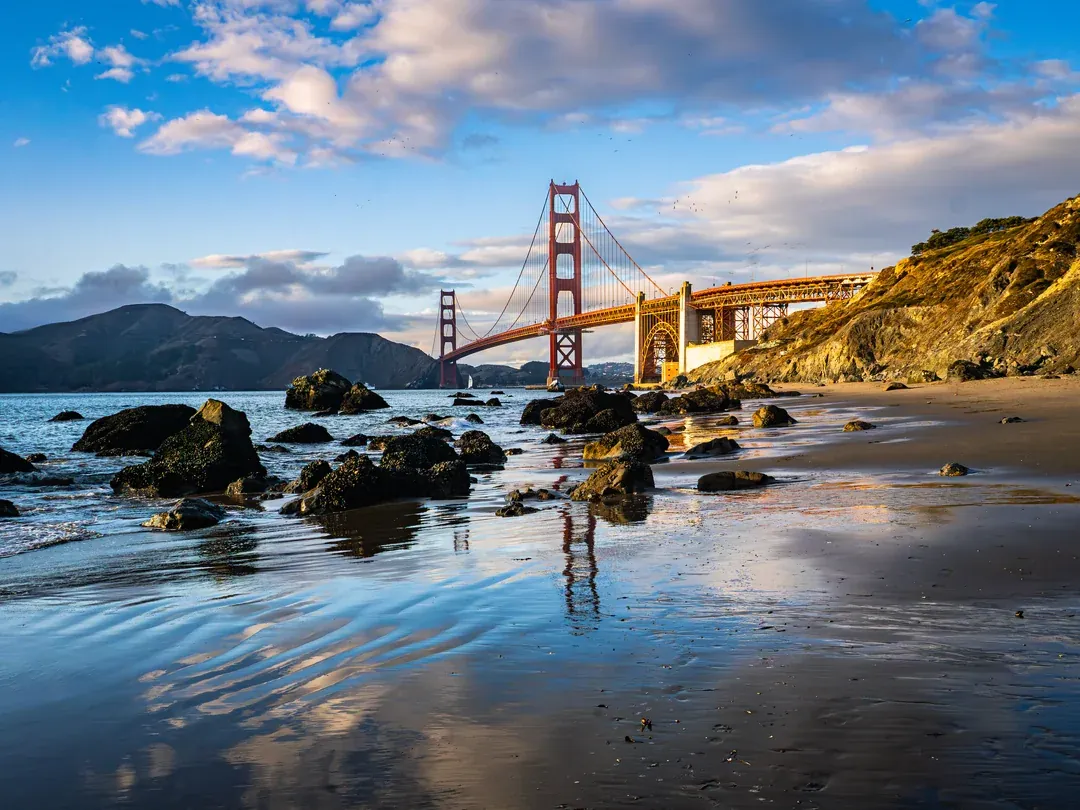 Marshall's Beach, San Francisco, with the Golden Gate Bridge reflected in wet sand