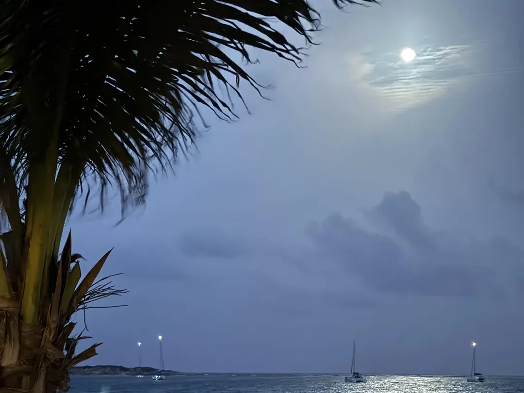Orient Bay, Saint-Martin, at night with boats moored offshore
